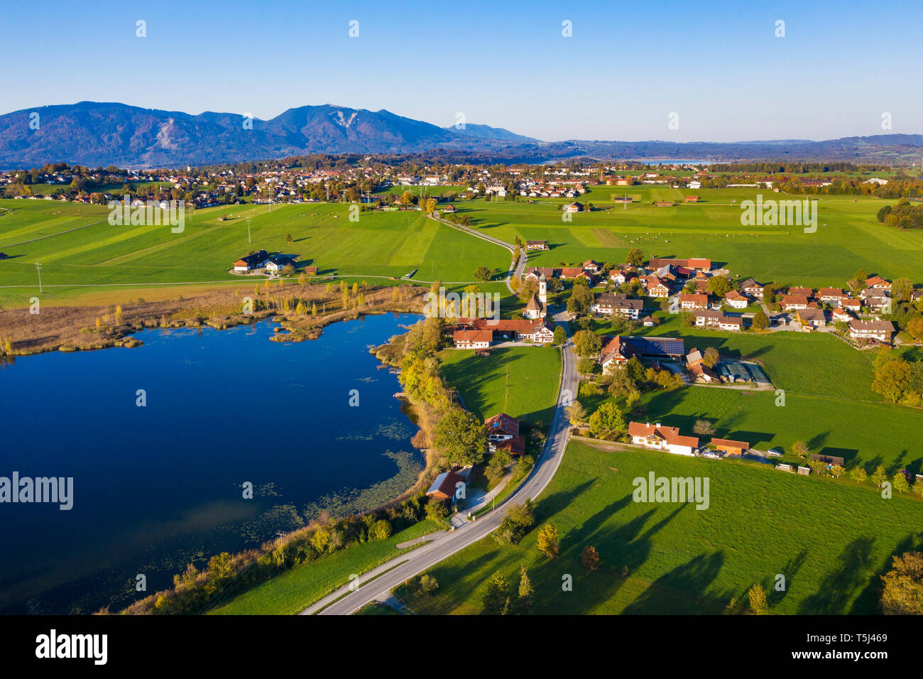 Germany, Upper Bavaria, Alpine foreland, Aerial view of Froschhausen, Froschhauser See, Murnau at Staffelsee in the background Stock Photo