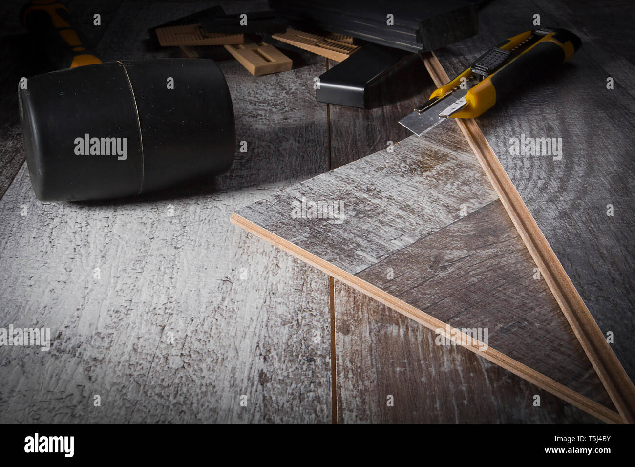 Laminate and various tools for its installation Stock Photo - Alamy