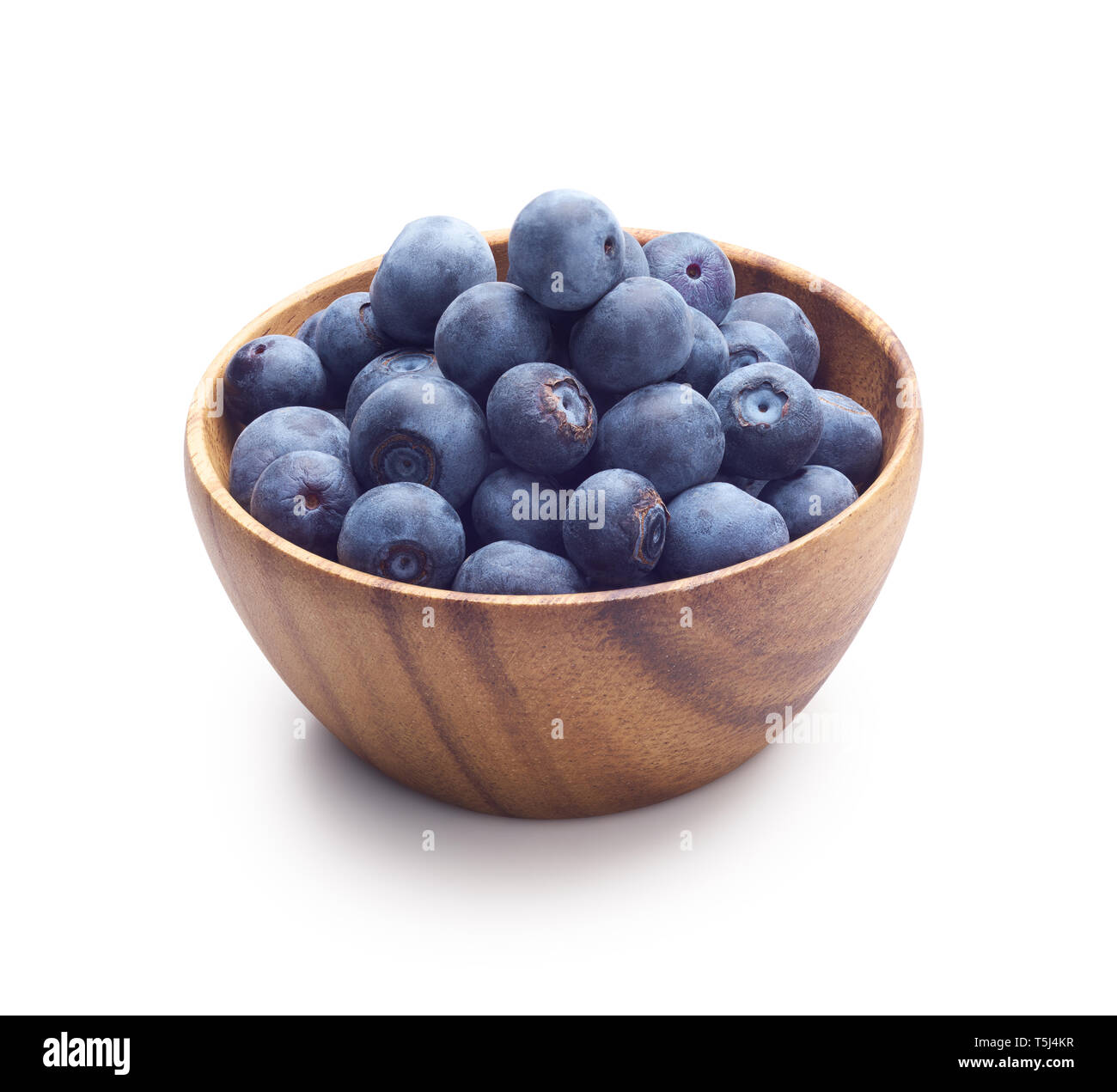 Wooden bowl filled with blueberry isolated on white background Stock Photo