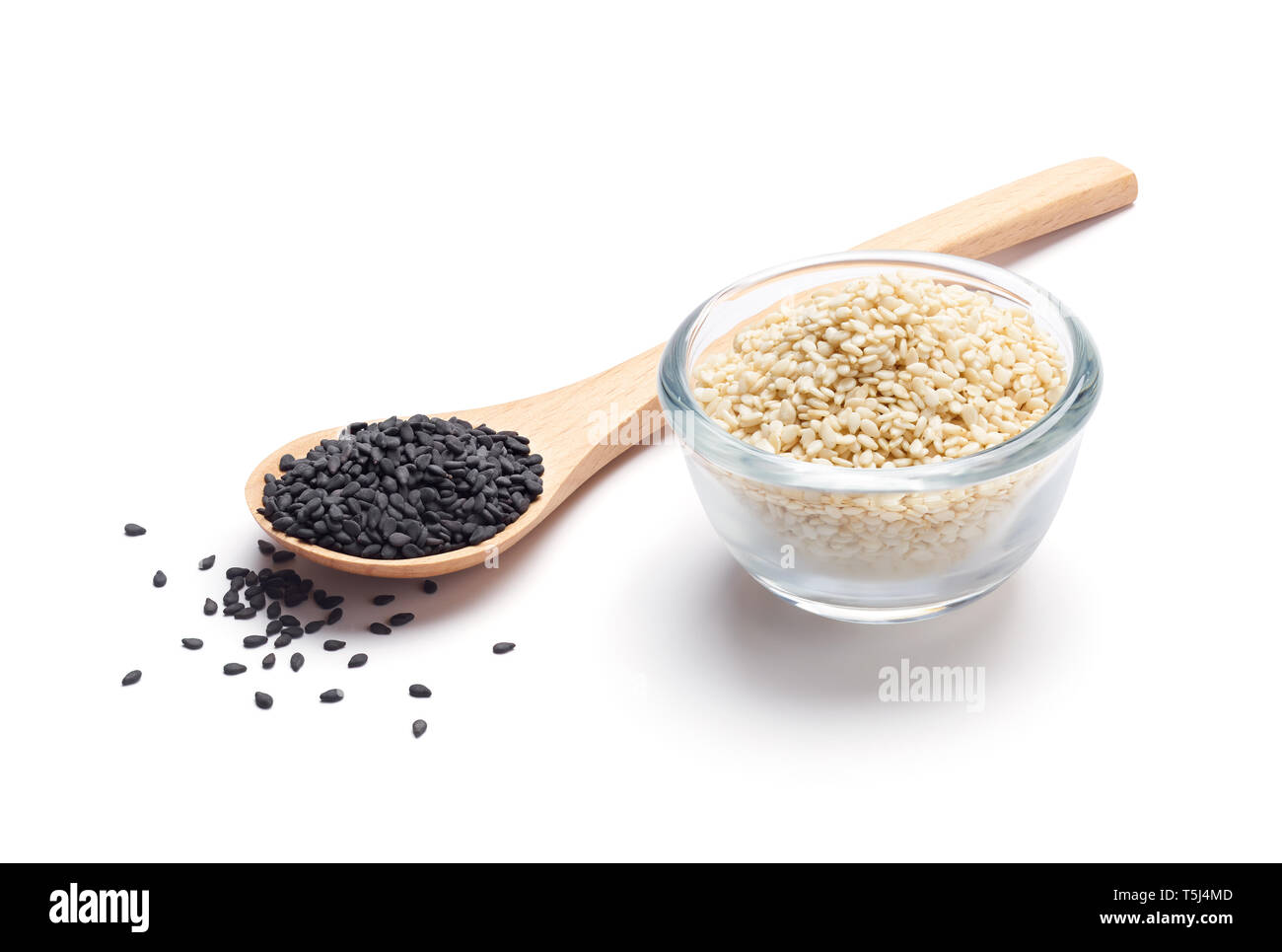 Black and white sesame seeds isolated on white background Stock Photo