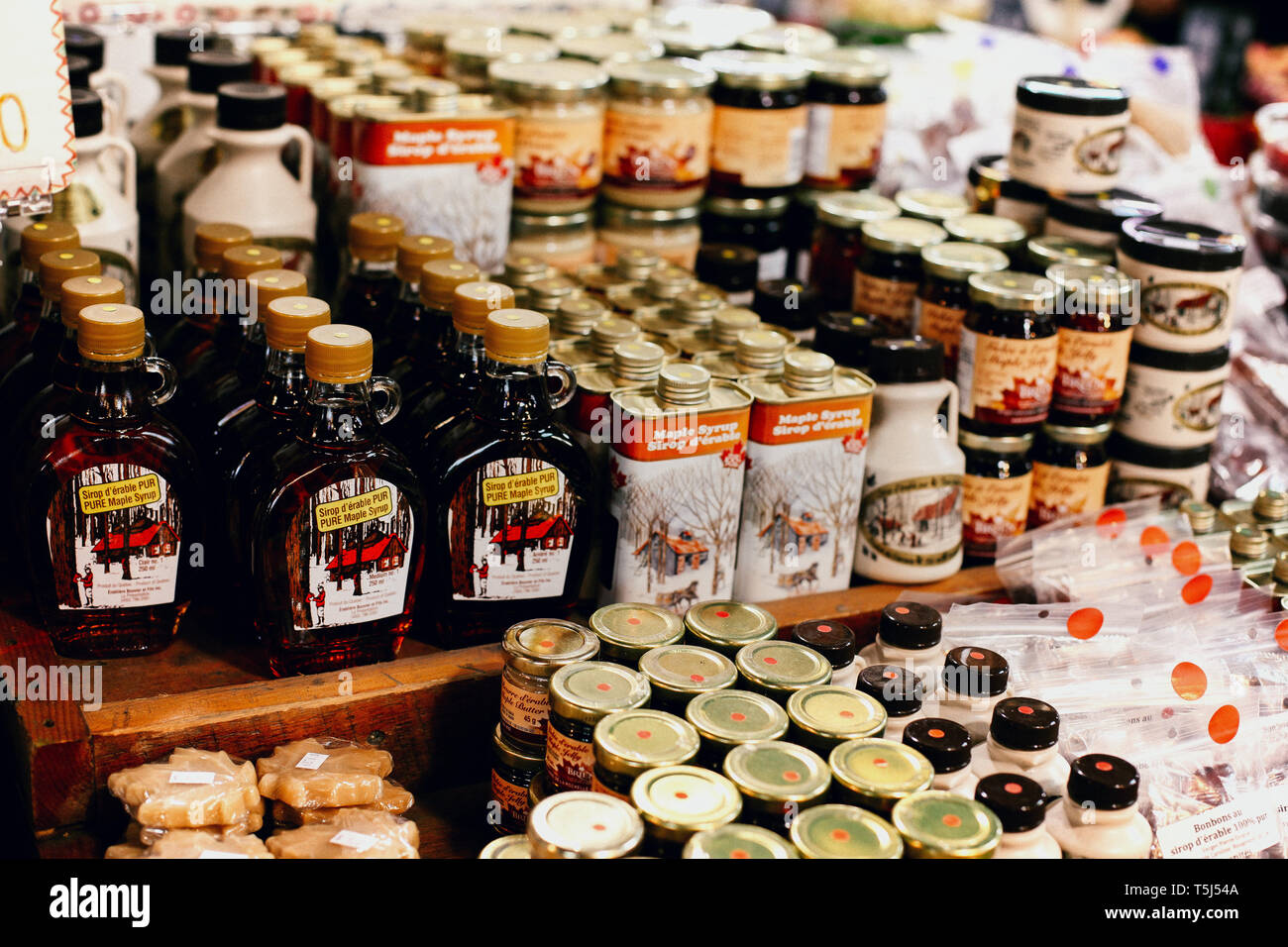 Bottles and cans of maple syrup for sale at Jean Talon Market in