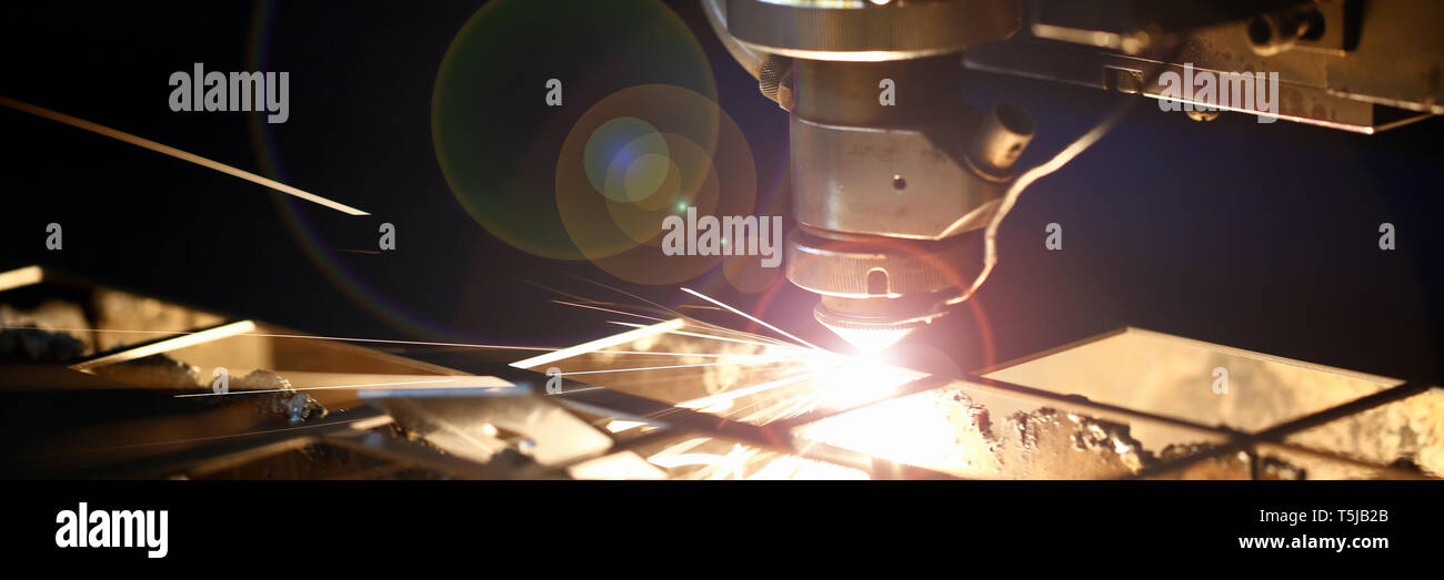 Sparks fly out machine head for metal processing Stock Photo