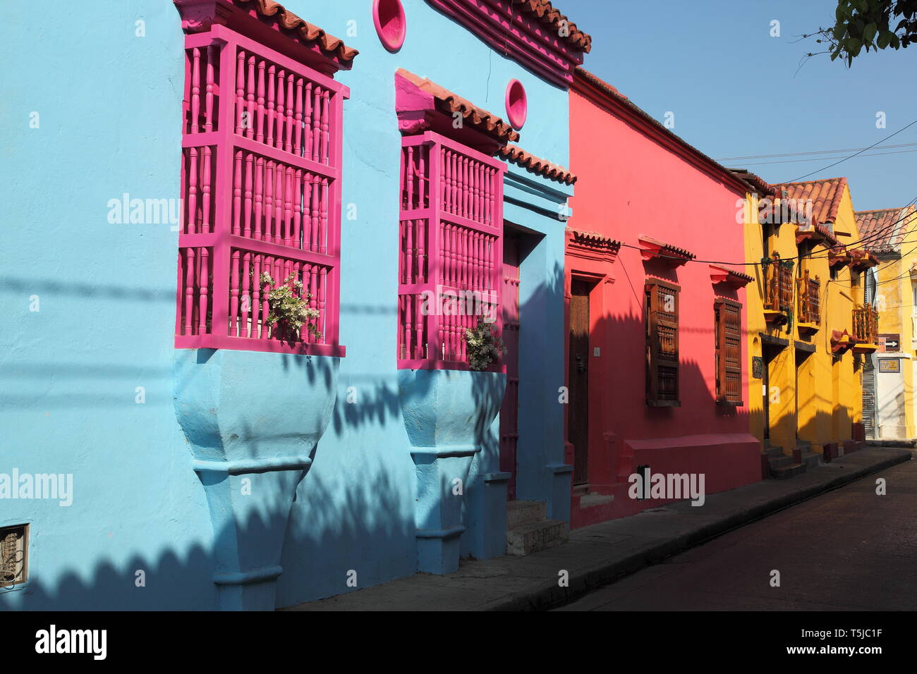 Colourful single storey painted houses in Spanish colonial style architecture in the Historic centre of Cartagena in Colombia Stock Photo