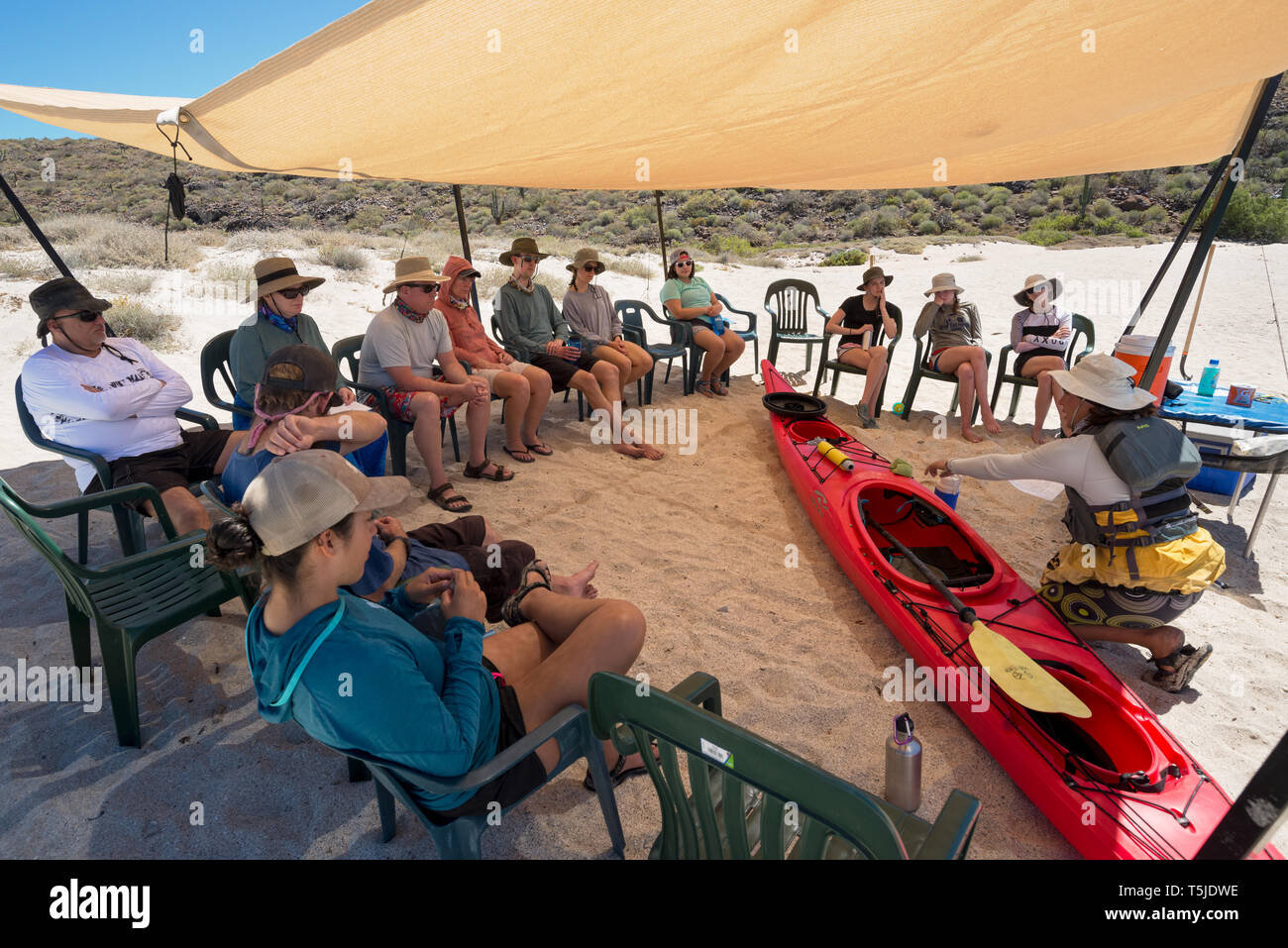 Guide giving sea kayak instruction to group on Espiritu Santo Island, Baja California Sur, Mexico. Stock Photo