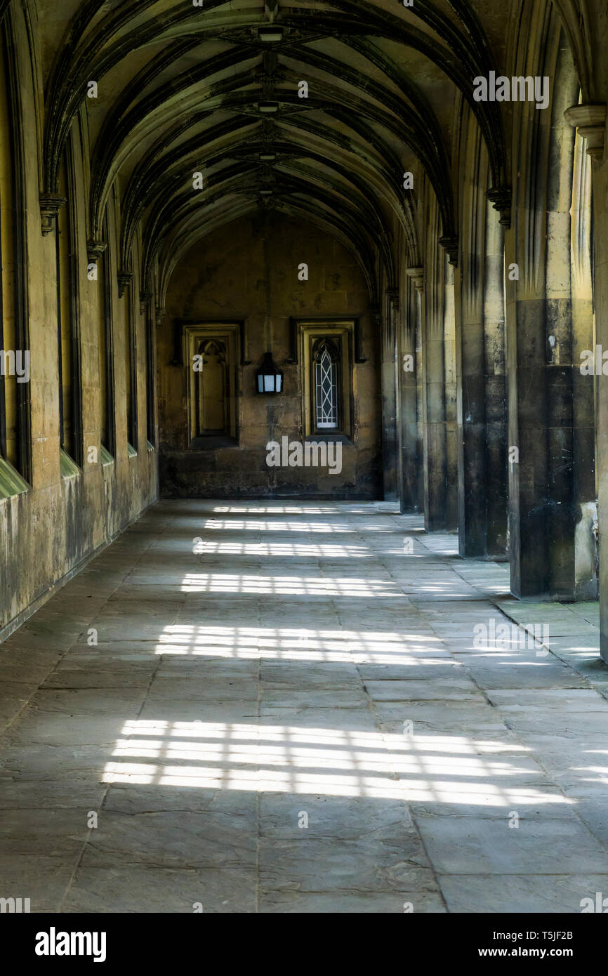 Covered walkway showing light pattern on floor at New Court St Johns college Cambridge Stock Photo