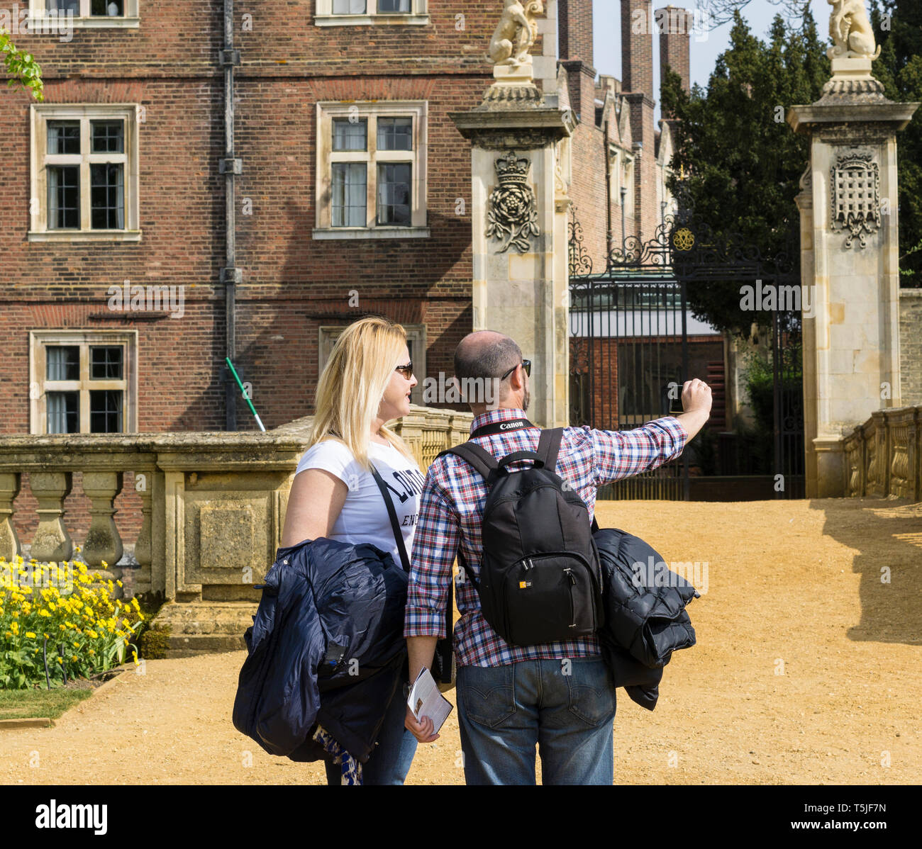 Tourist couple taking selfie at St Johns College Cambridge Stock Photo