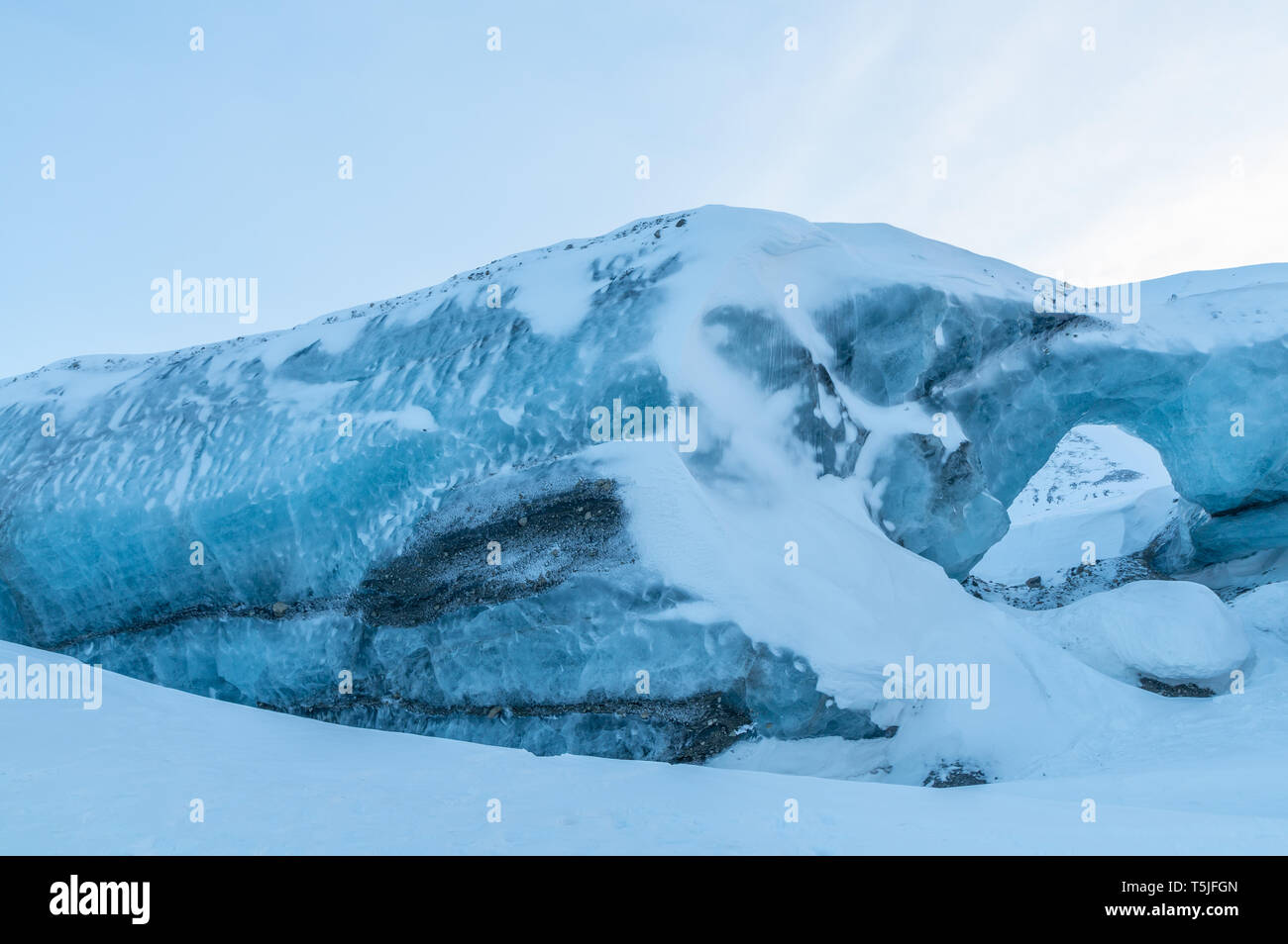 Arch of glacial ice in high arctic of Svalbard Stock Photo