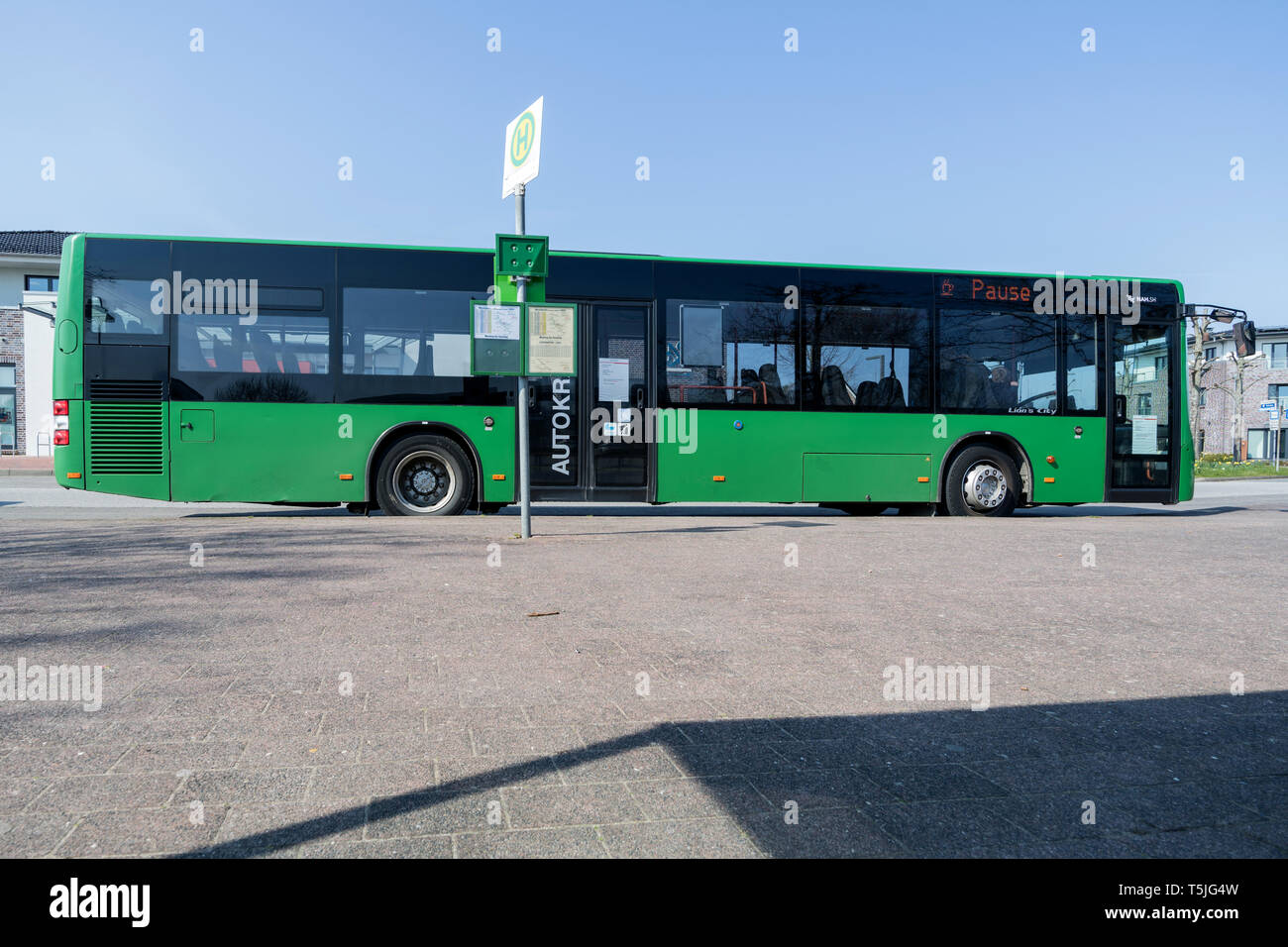 Autokraft bus at bus stop. Autokraft GmbH is the largest bus transport company in Schleswig-Holstein and a subsidiary of DB Regio. Stock Photo