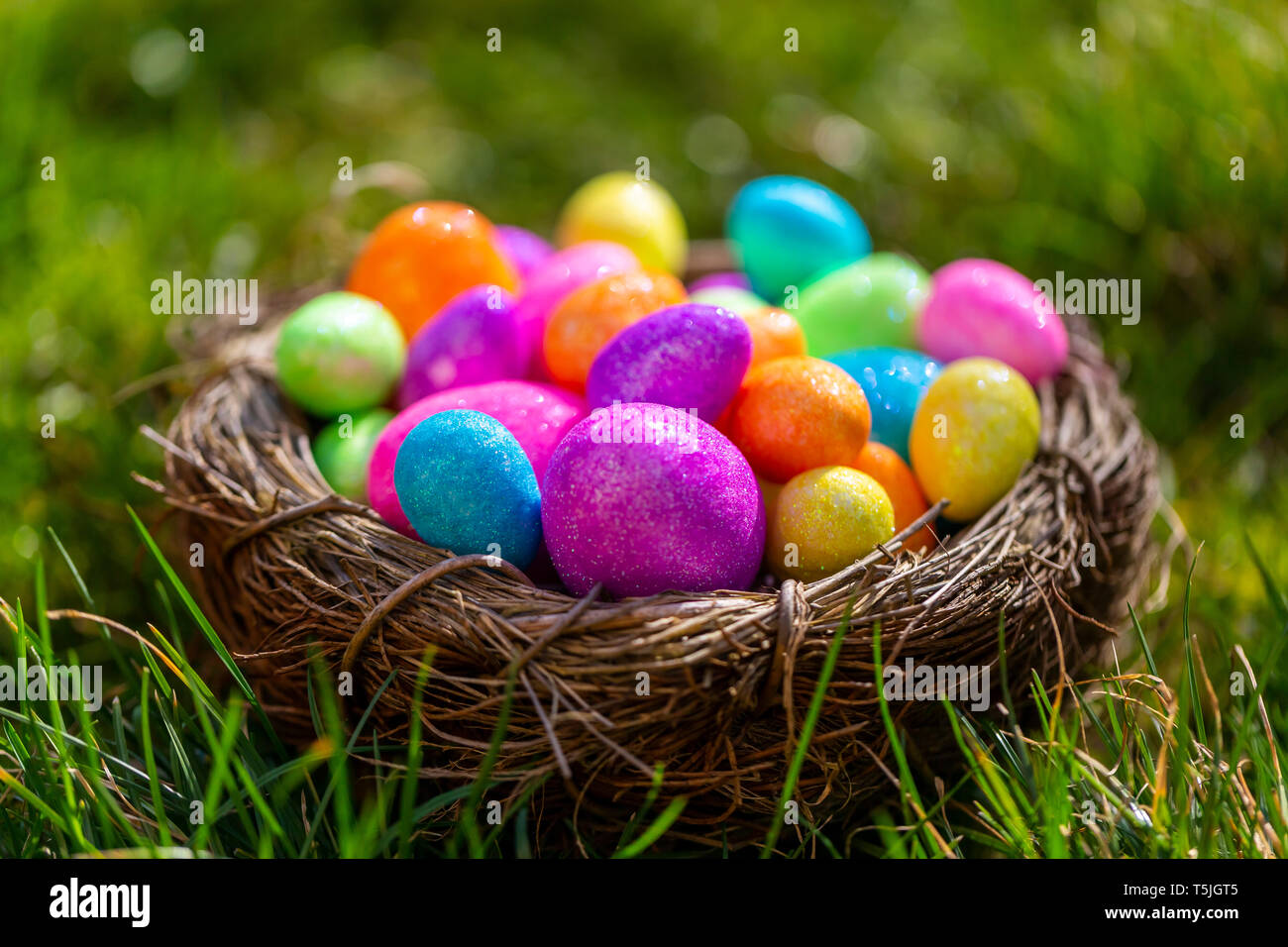 Sparkling Easter eggs in nest Stock Photo - Alamy