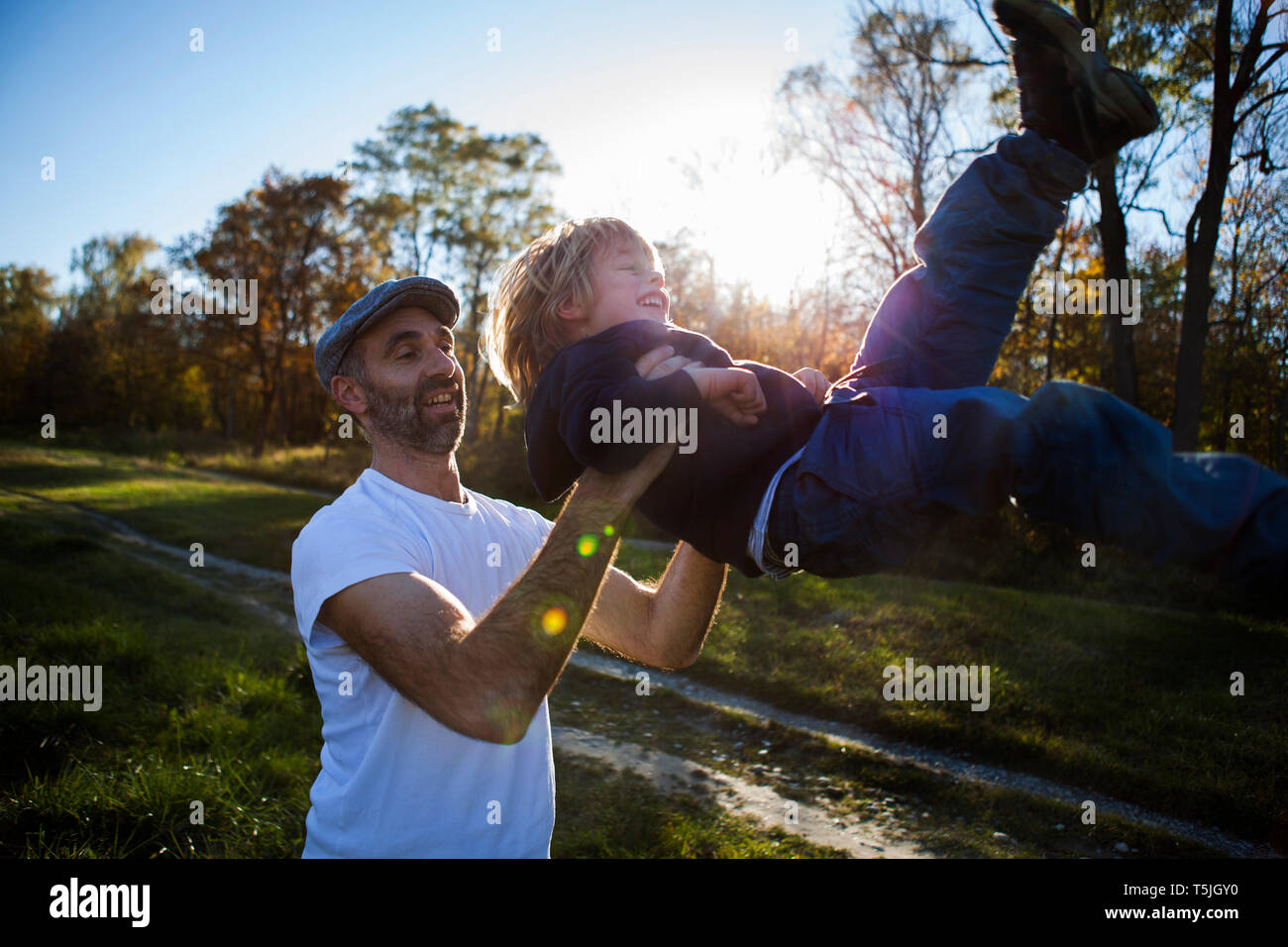 Father playing with his little son  outdoors Stock Photo