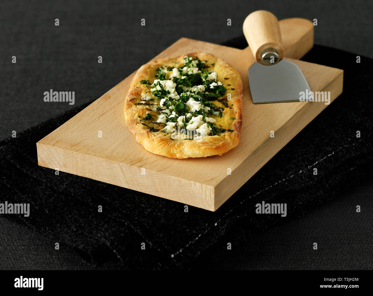 Cheese and spinach pizza Stock Photo