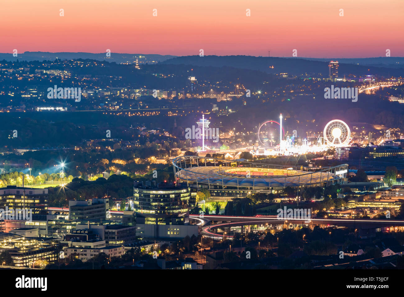 Germany, Baden-Wuerttemberg, Stuttgart, Bad Cannstatt, Mercedes-Benz Factory, Mercedes-Benz Arena and Cannstatter Wasen at night Stock Photo