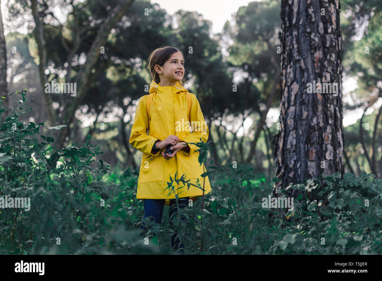 Yellow raincoat hi-res stock photography and images - Alamy