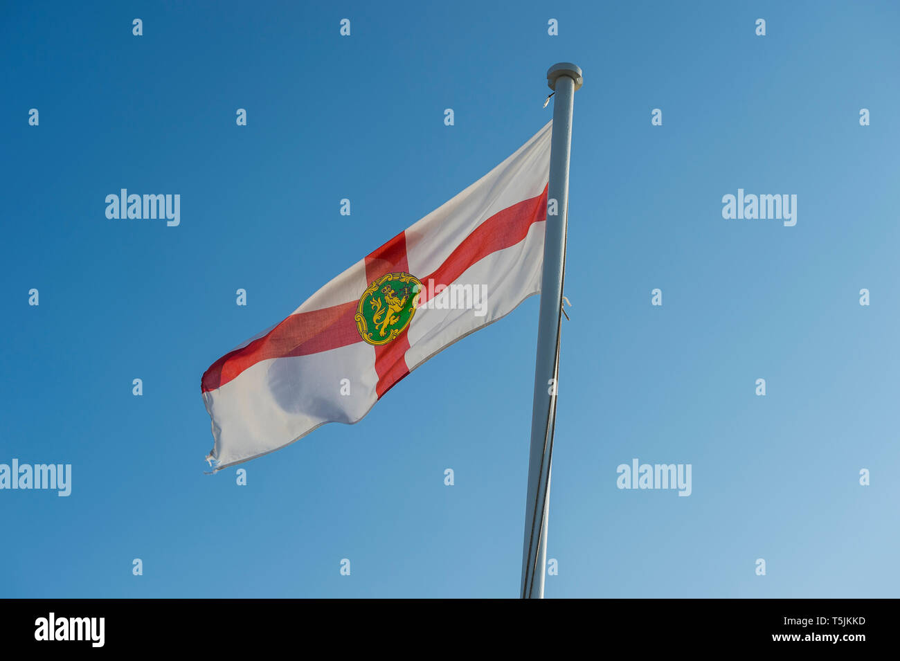 Channel Islands Jersey Flag Against Blue Sky Stock Photo - Download Image  Now - Jersey - England, Flag, Channel Islands - England - iStock