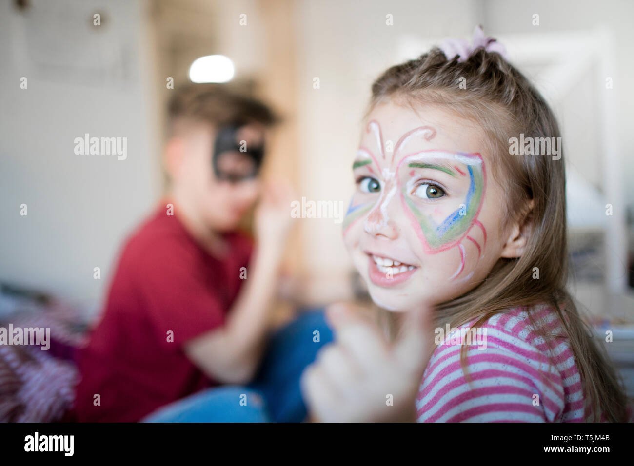 Brother and sister preparing for carneval Stock Photo