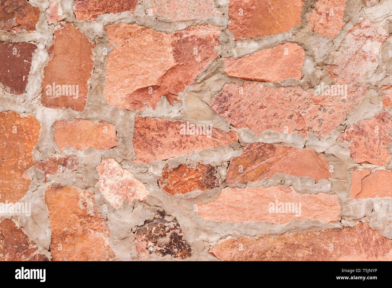 Red Stone Wall Outdoor Background And Texture Of Decorative Slate