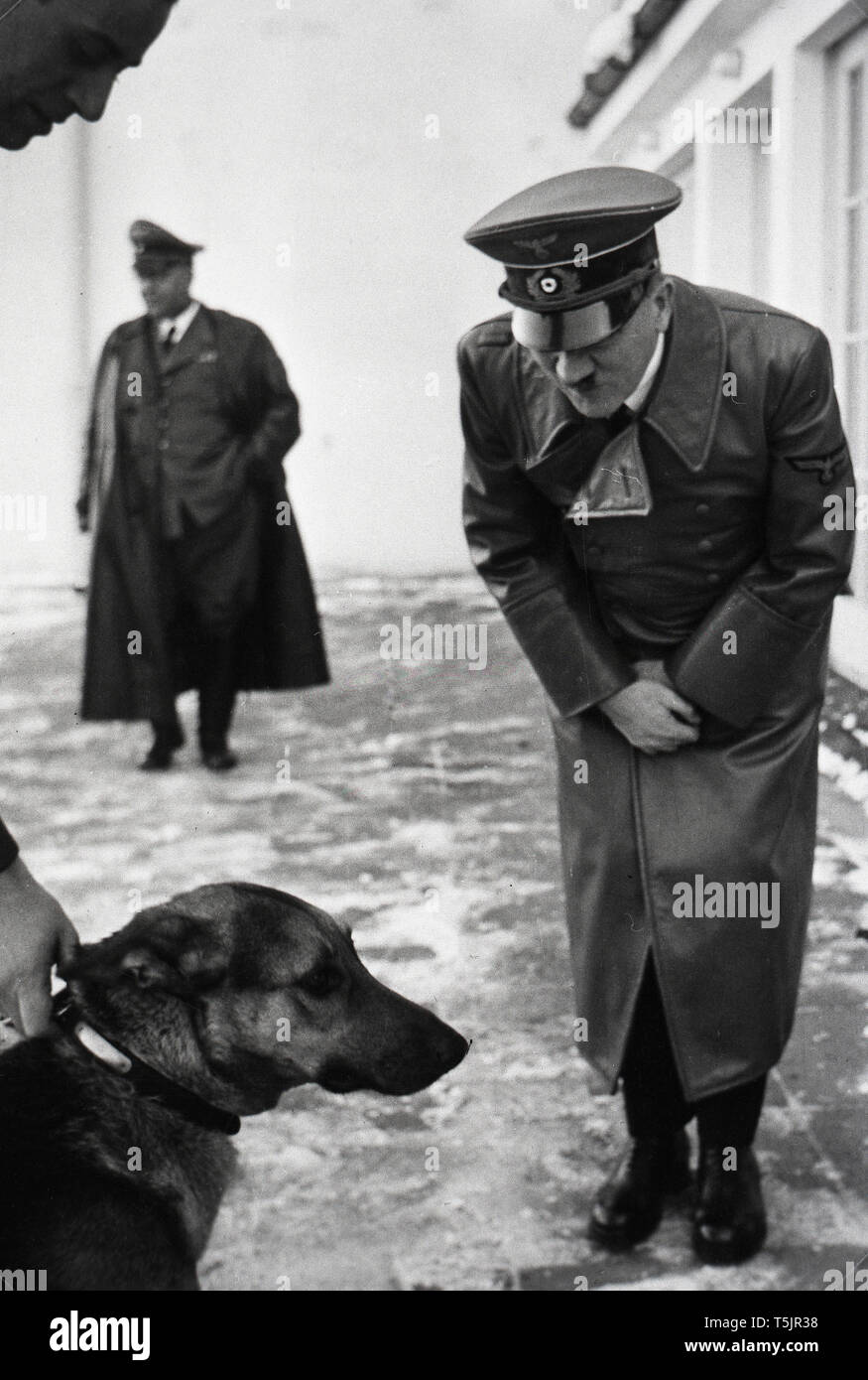 Eva Braun Collection (osam) - Adolf Hitler greeting a dog ca. late 1930s or early 1940s Stock Photo
