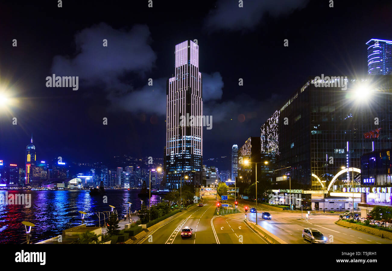 Hong Kong - August 7, 2018: Hong Kong modern skyline and street scene view from the Victoria harbor at night Stock Photo