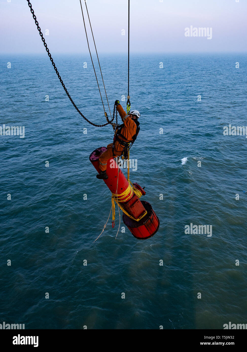Abseilers rigging equipment on offshore platform Stock Photo Alamy