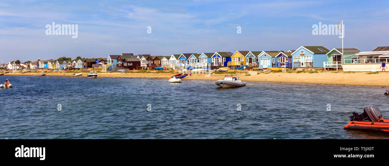 View of the beach huts on Mudeford Sandbank, Christchurch Dorset. England UK taken from the Mudeford Ferry Stock Photo