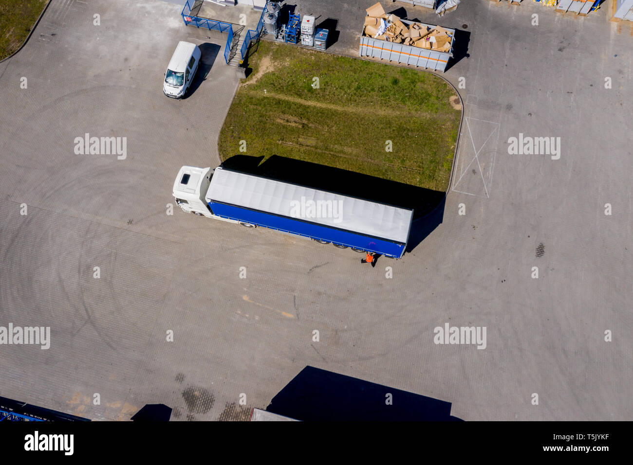 Aerial view of trucks and trailers. Distribution logistics buildings