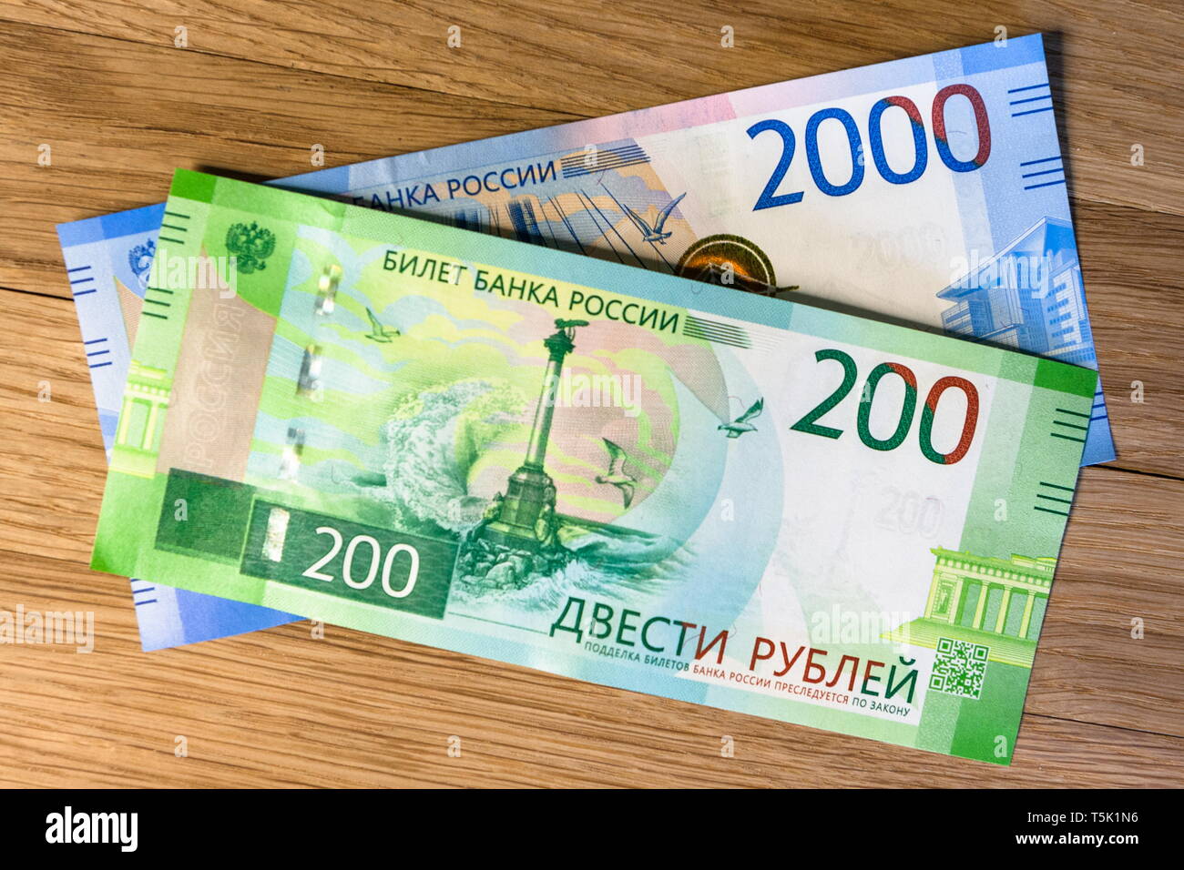 Money on a woody background. Rubles Stock Photo