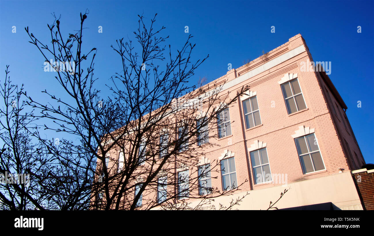 A Restored Art Deco Building Painted In Pink With White