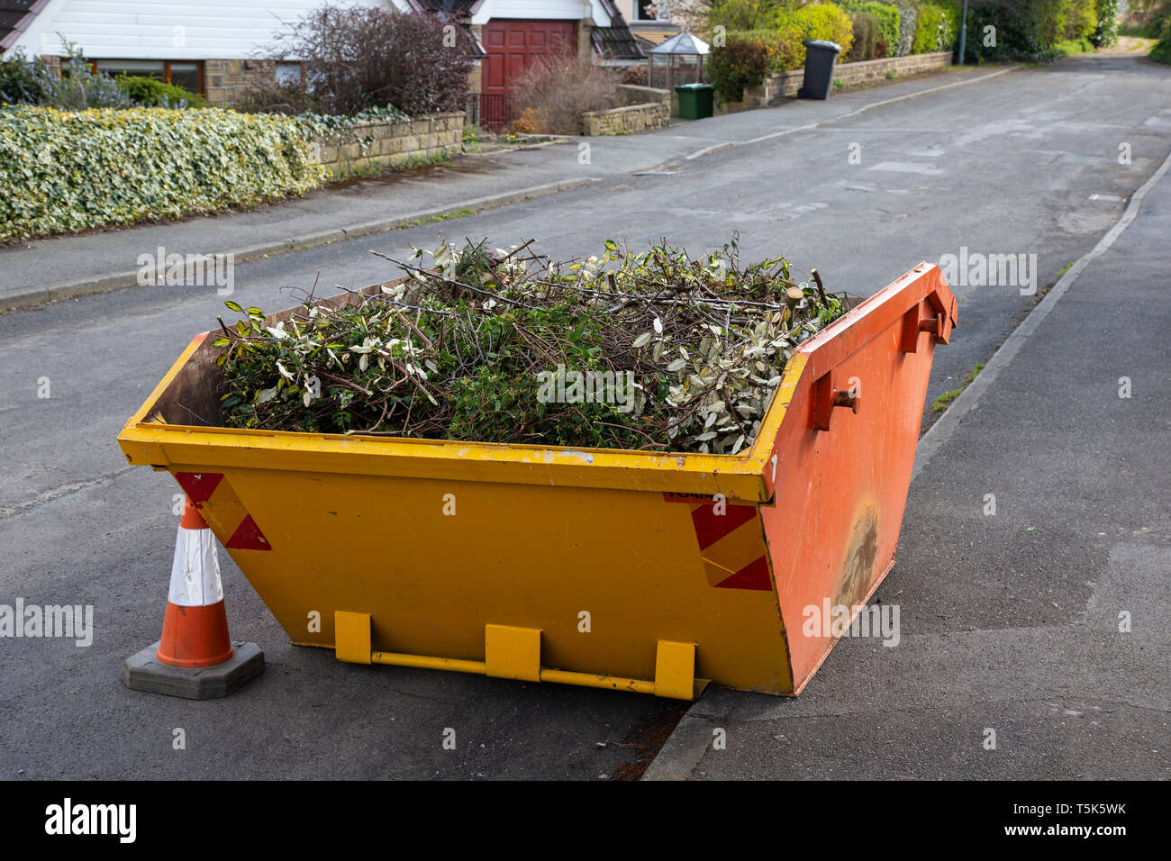 Skip rubbish container hires stock photography and images Alamy