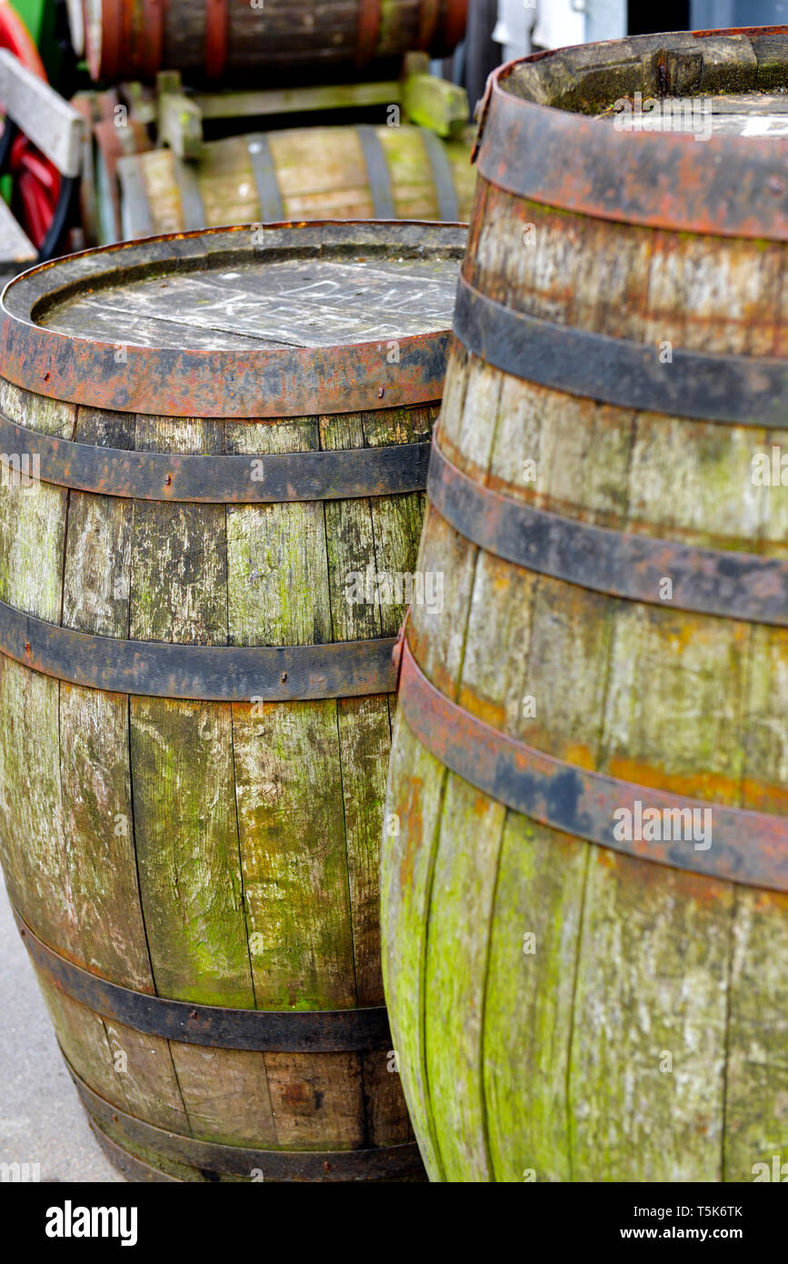 Old, antique wooden barrel freight shipping containers Stock Photo