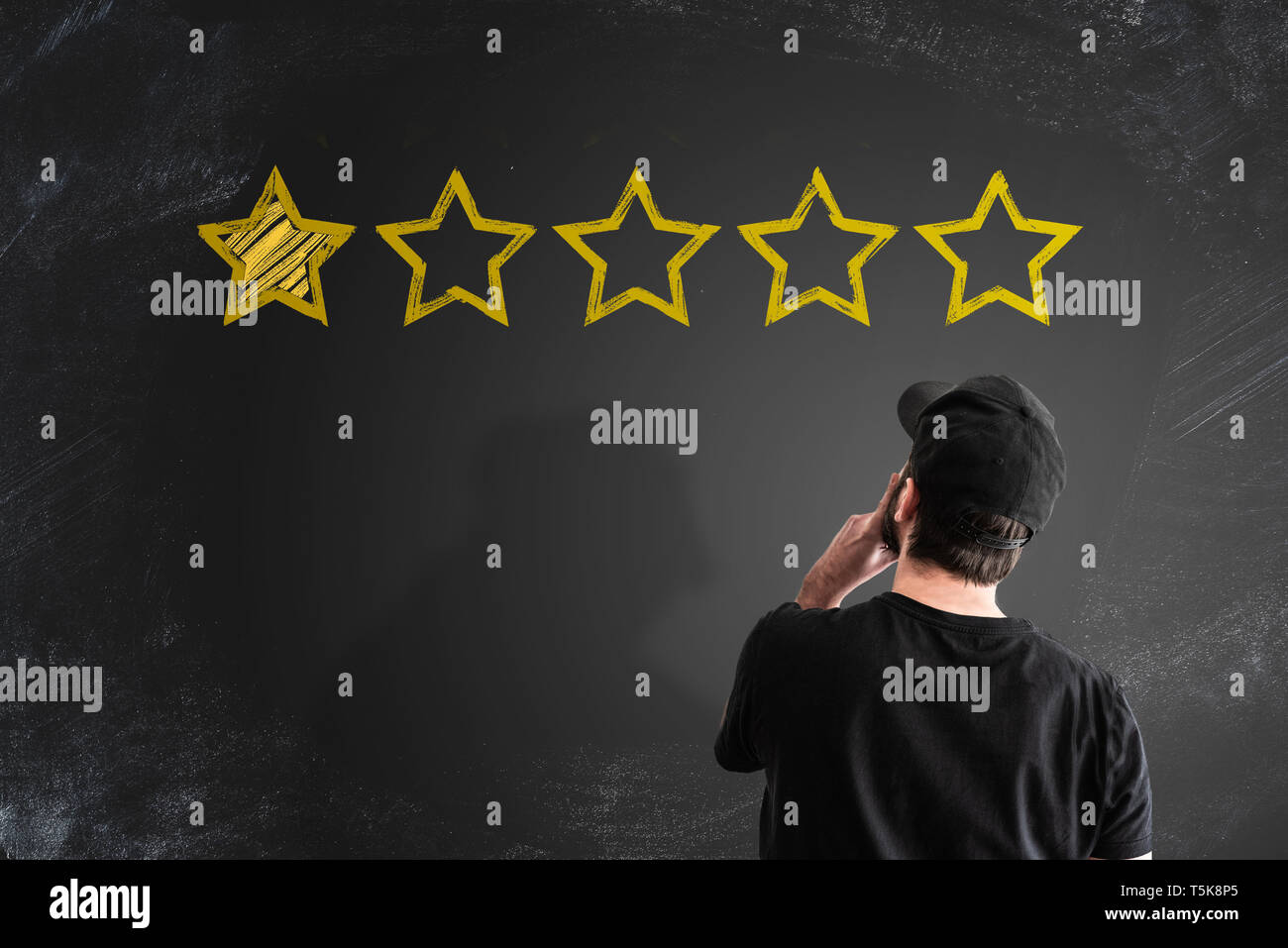 negative service rating or customer feedback concept with stars on blackboard Stock Photo