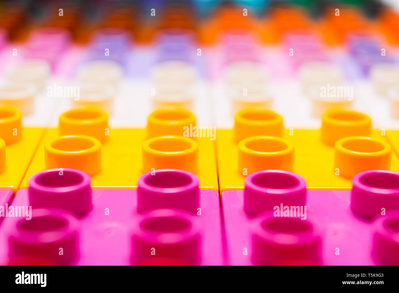 Colorful constructor art design background. selective focus. Plastic toy bricks Stock Photo