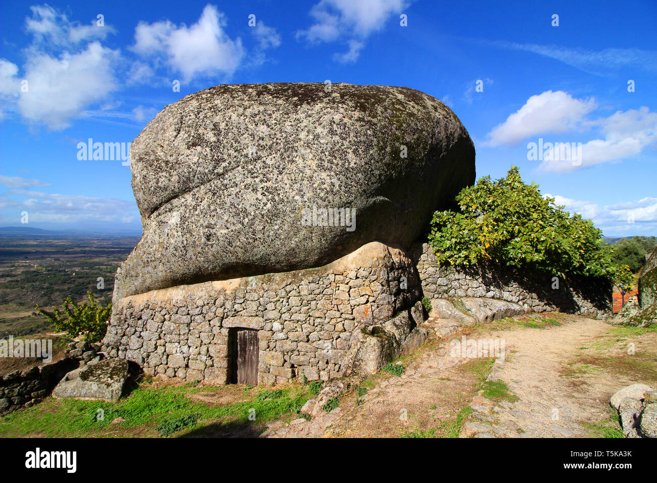 House buillt in it's natural boulder, rocky environment in one of the 12 historical villages in Portugal, Monsanto high on the hill Stock Photo