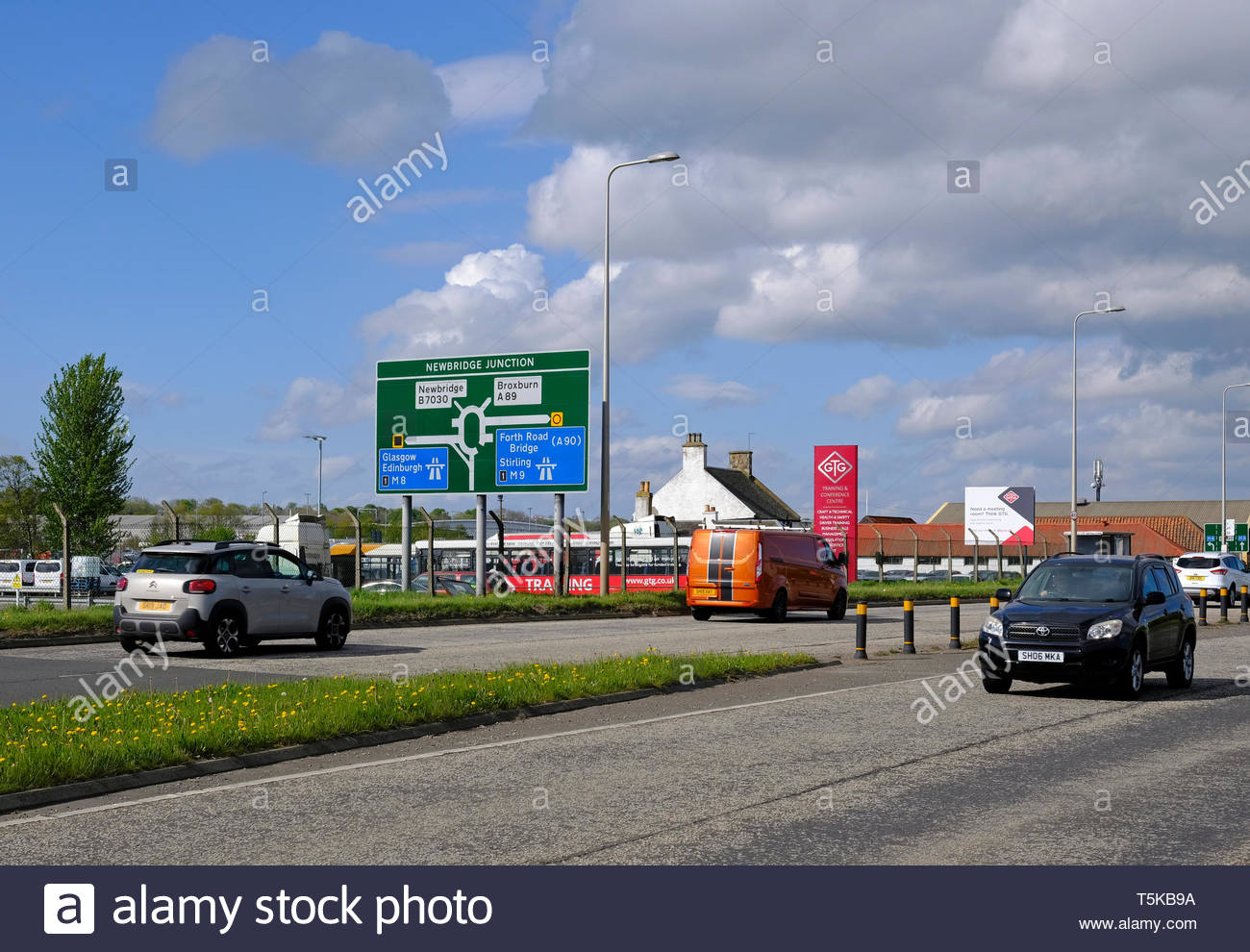 Traffic on the A8 Dual Carriageway approaching the Newbridge intersection junction 1 of the M9 motorway, outside Edinburgh, Scotland Stock Photo