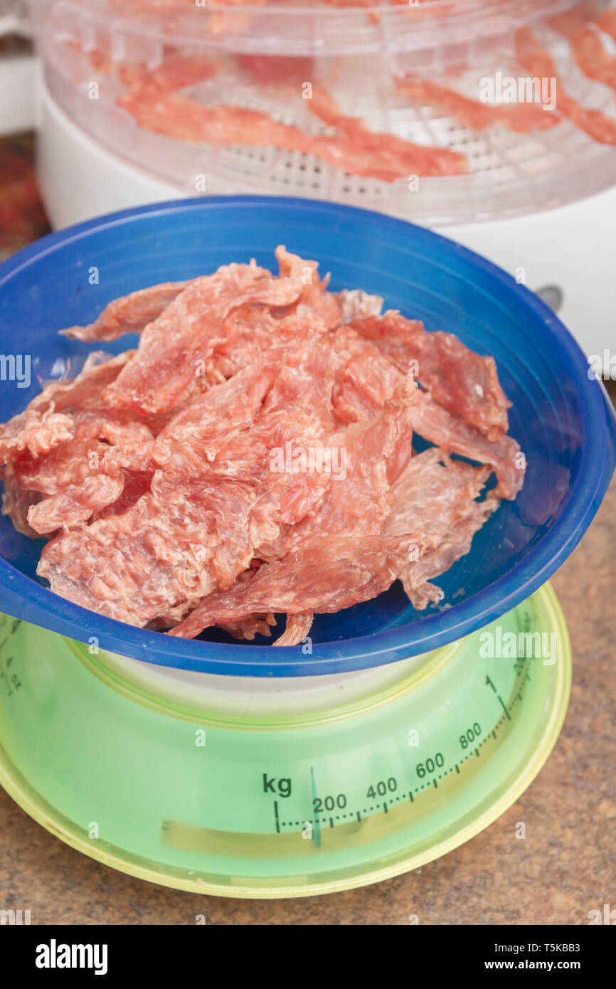 Dried meat 200 grams lies on plastic scales Stock Photo Alamy