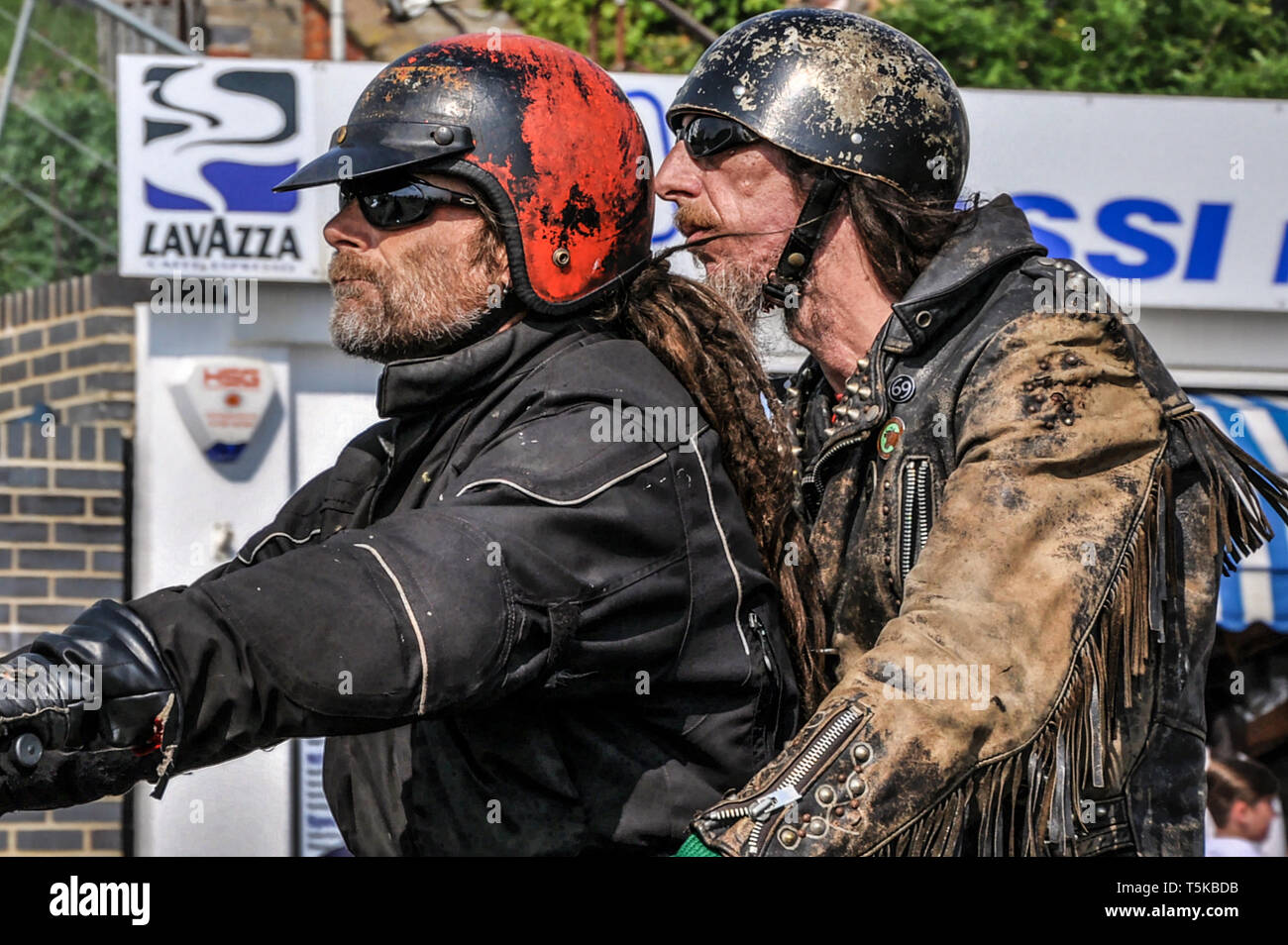Grizzled rocker bikers at the Southend Shakedown 2014 motorcycle rally, Southend on Sea, Essex, UK. Unshaven character faces. Space for copy Stock Photo