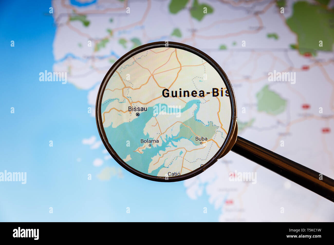 Bissau, Guinea-Bissau. Political map. City visualization illustrative concept on display screen through magnifying glass. Stock Photo