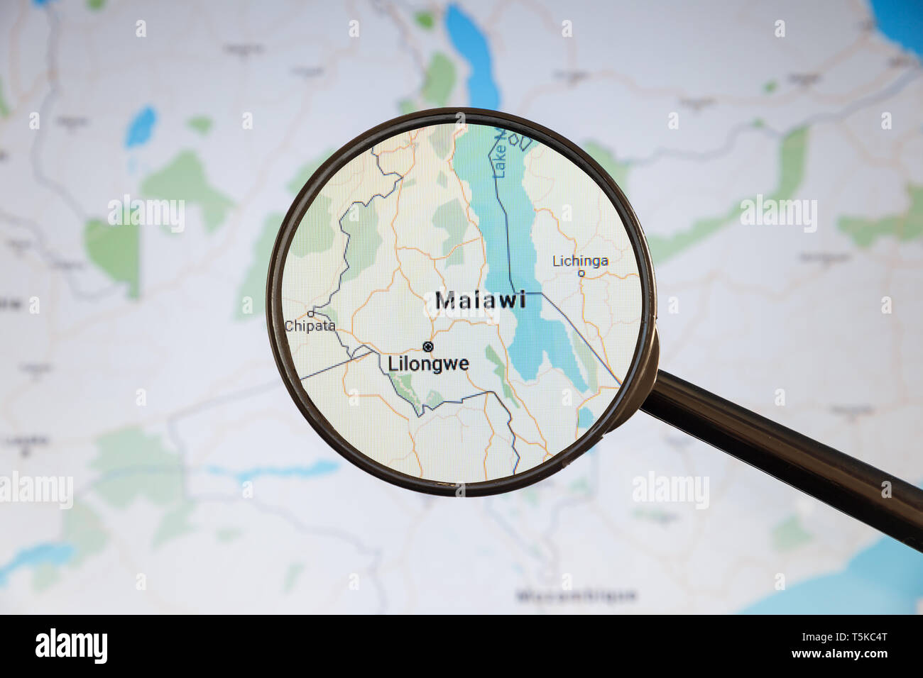 Lilongwe, Malawi. Political map. City visualization illustrative concept on display screen through magnifying glass. Stock Photo
