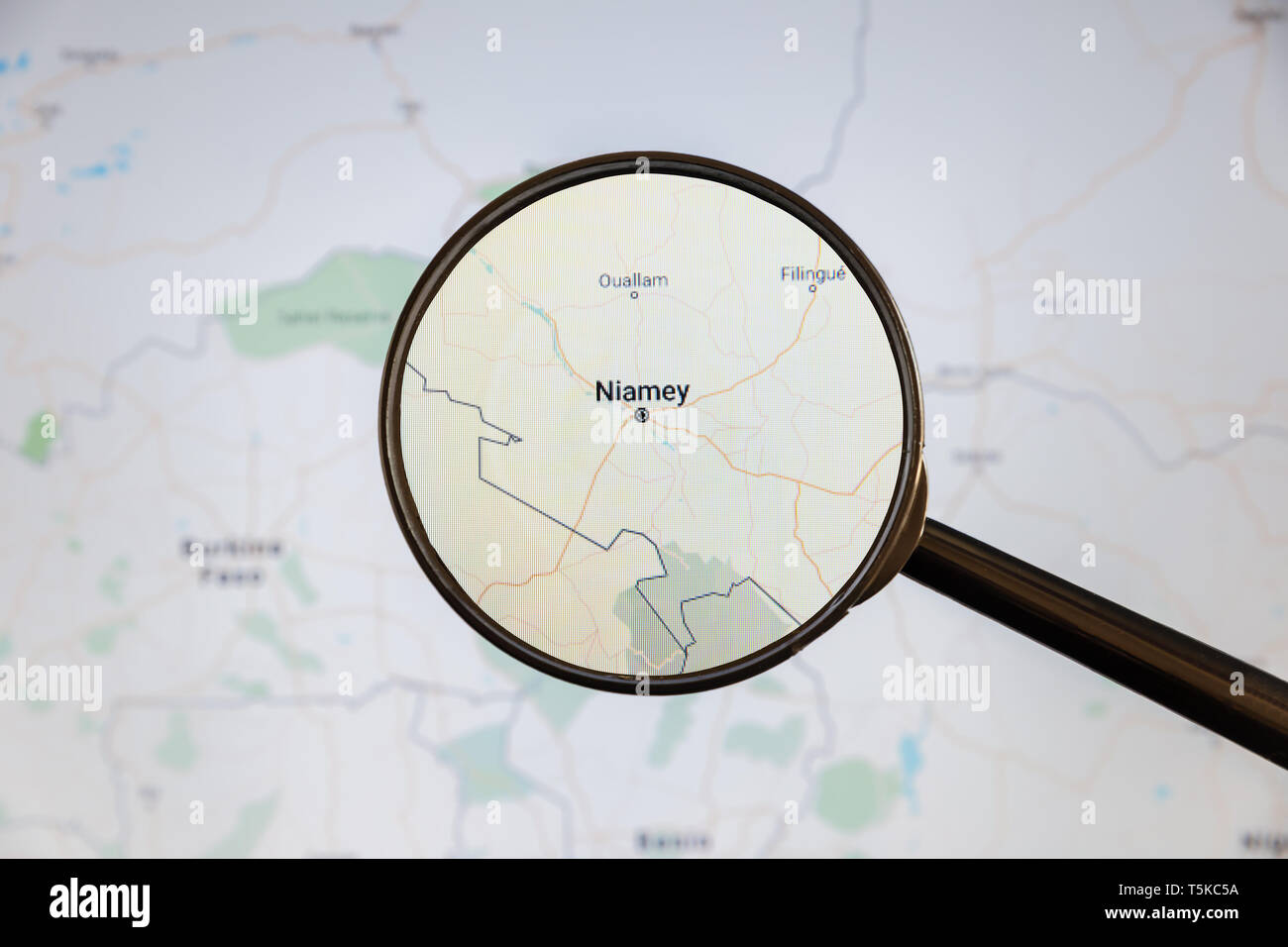 Niamey, Niger. Political map. City visualization illustrative concept on display screen through magnifying glass. Stock Photo