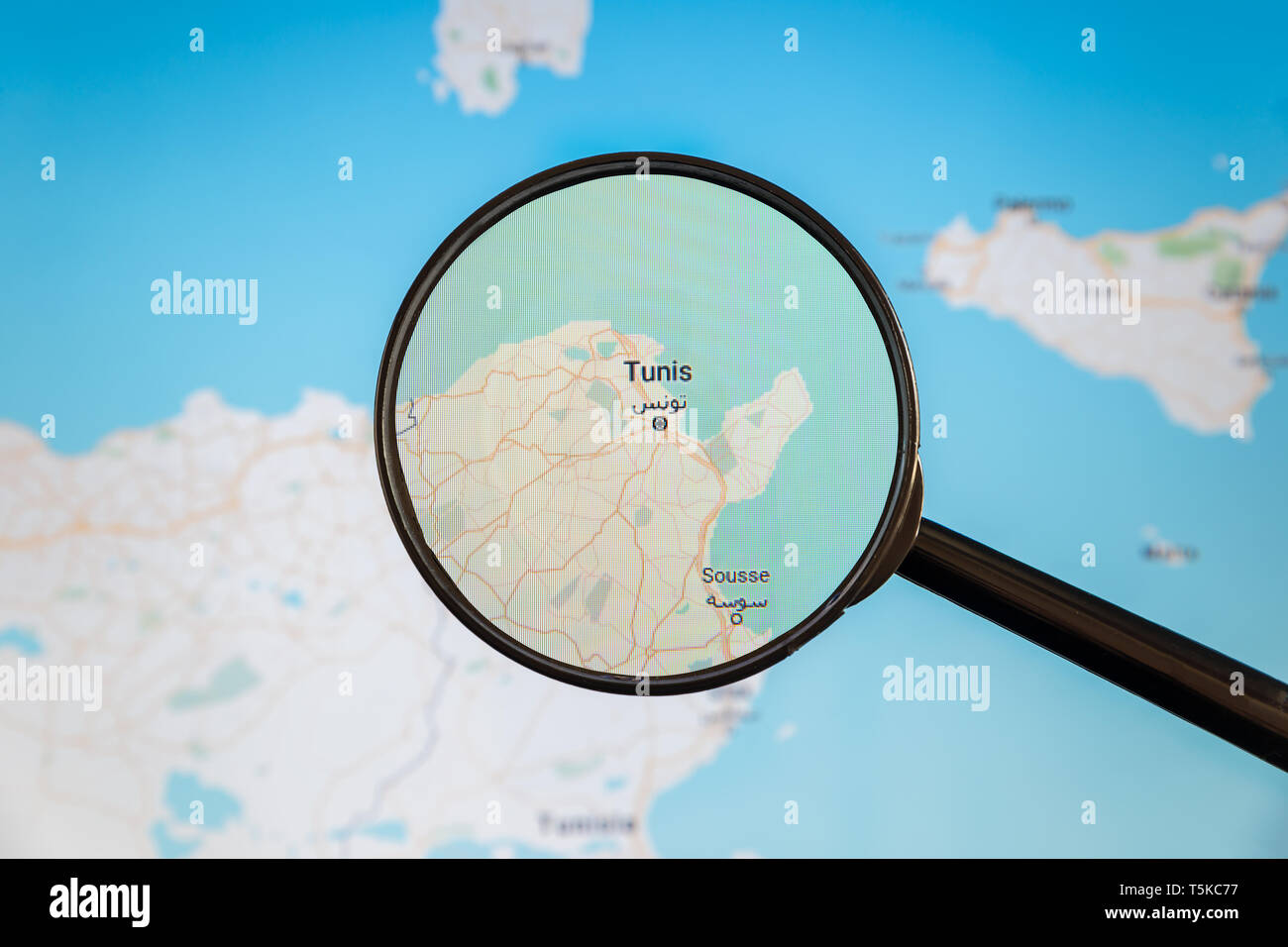 Tunis, Tunisia. Political map. City visualization illustrative concept on display screen through magnifying glass. Stock Photo