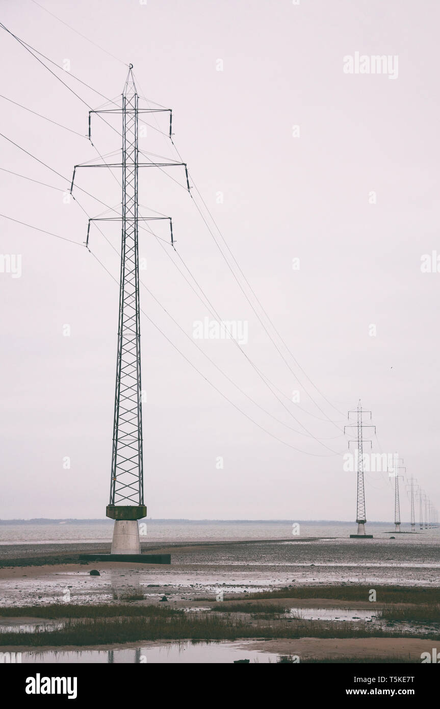 Power lines over ocean channel Stock Photo Alamy