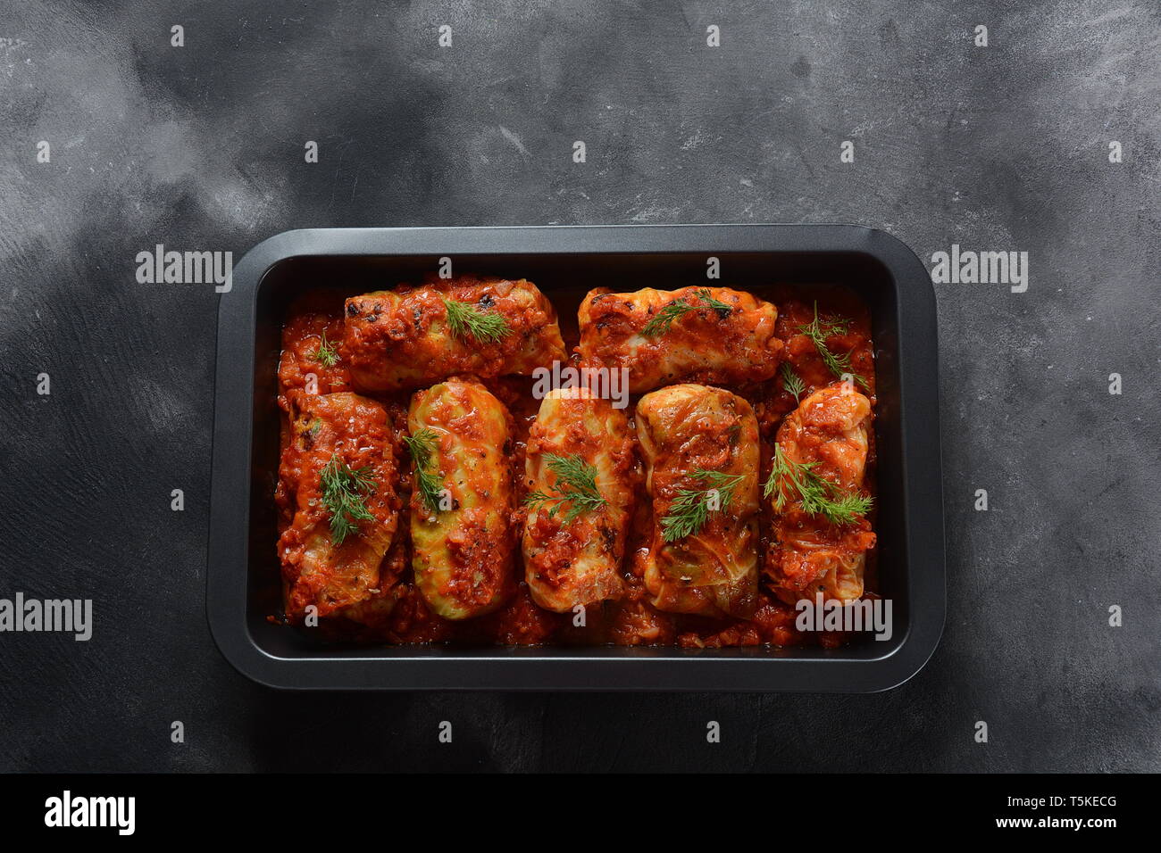 Cabbage rolls with chicken meat and rice in tomato sauce. Stuffed