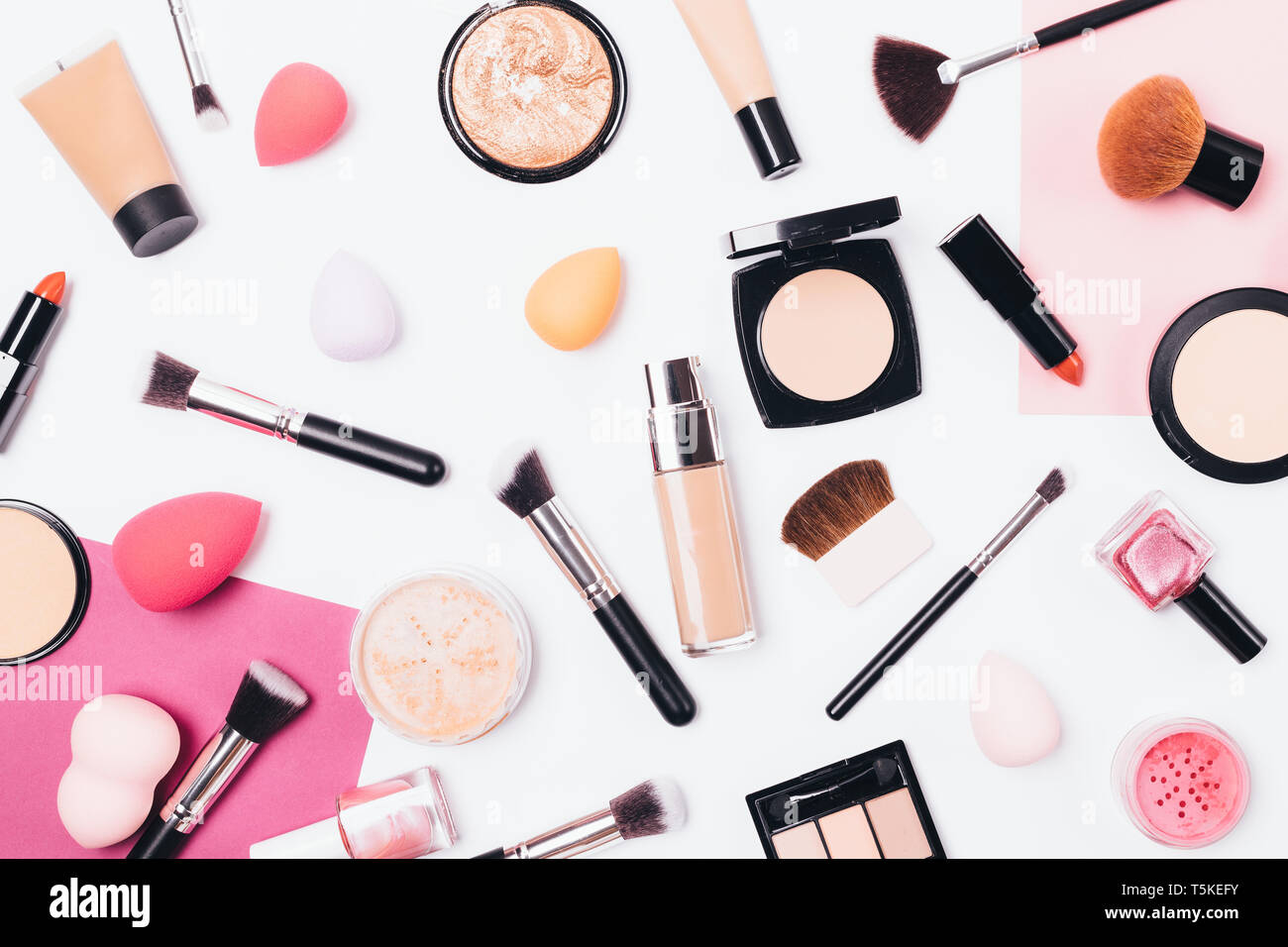 Makeup pattern background of beauty products on wooden table; top view.  Flat lay feminine cosmetics and accessories Stock Photo - Alamy