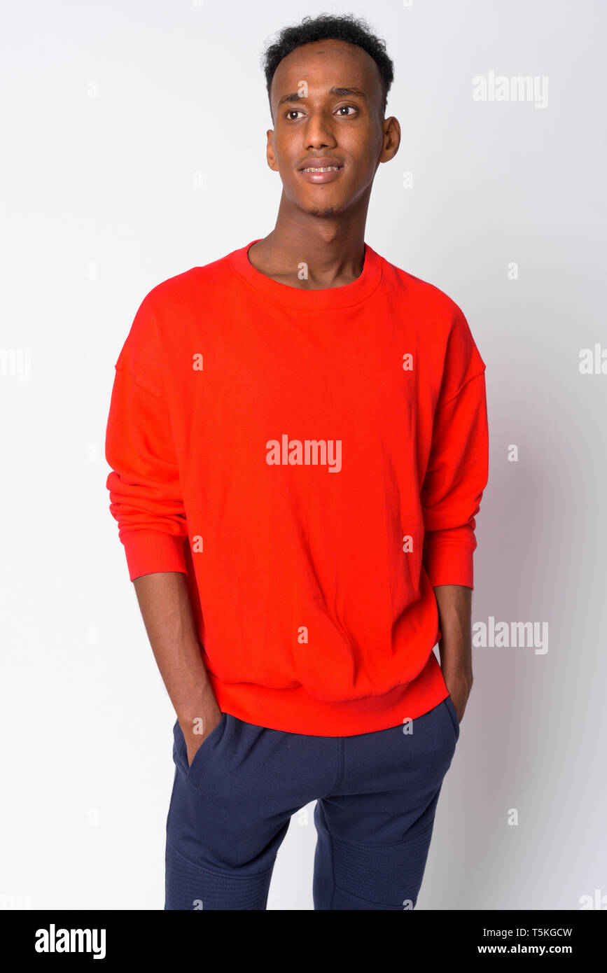 Portrait of young happy African man thinking Stock Photo - Alamy