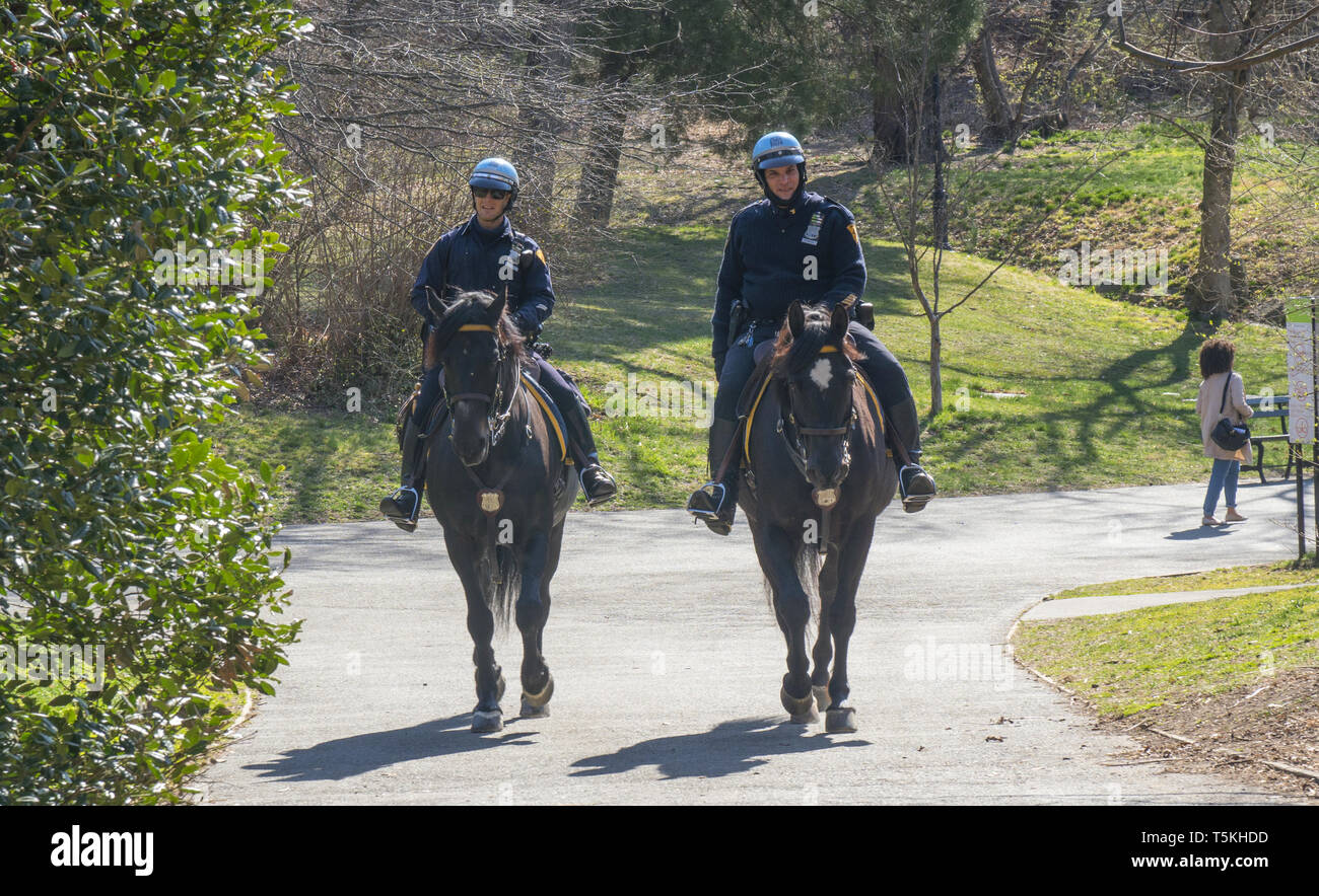 NYPD Police officers on patrol on horseback in Prospect Park, in the