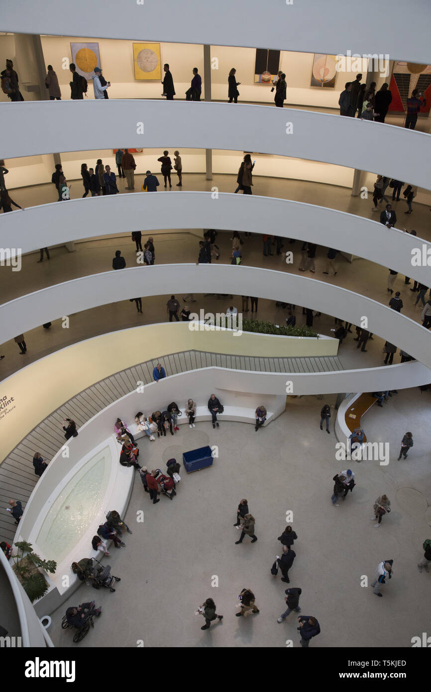 Museum goers at the Guggenheim Museum in New York City view the Hilma af Klint exhibition the
