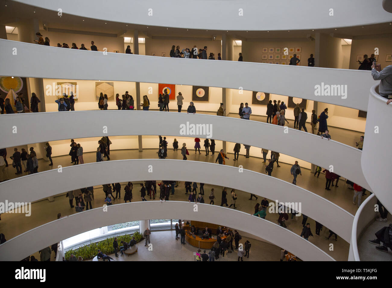 Museum goers at the Guggenheim Museum in New York City view the Hilma af Klint exhibition the