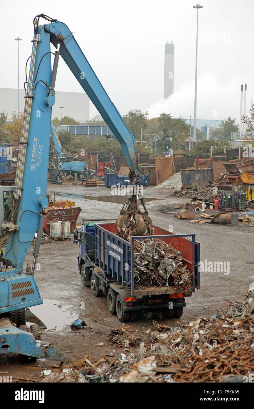 Recycling metal and waste materials at a scrap yard in North London. 3