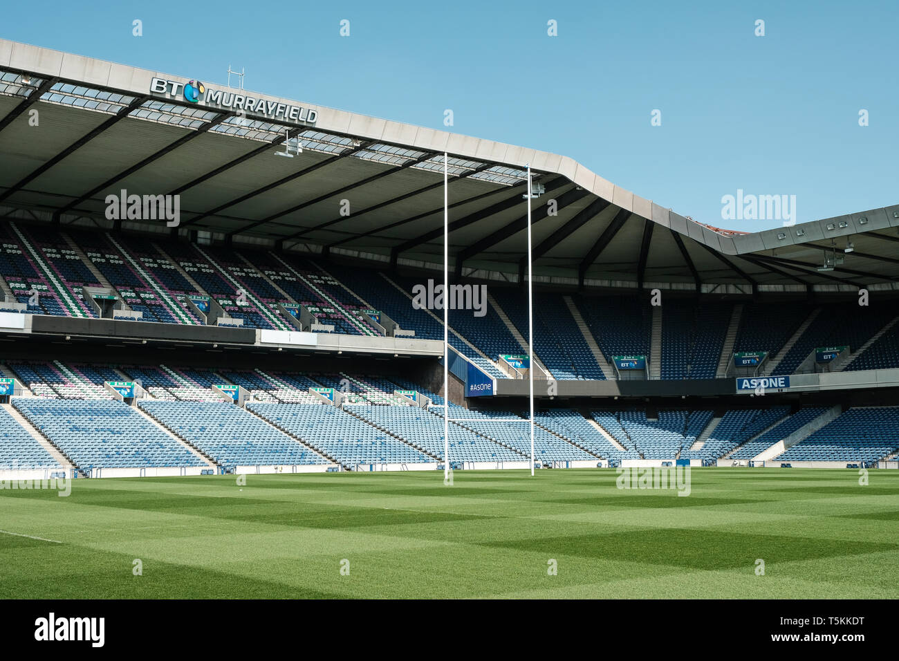 Murrayfield rugby stadium showing the north end stands and goalpost whilst empty on a sunny day, Edinburgh, East Lothian, Scotland Stock Photo