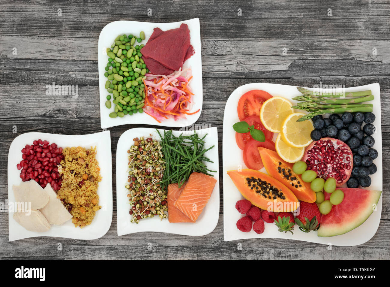 Diet health food for weight loss with fish, lean meat, fruit, vegetables  and salads with foods high in anthocyanins, antioxidants, vitamins & fibre  Stock Photo - Alamy