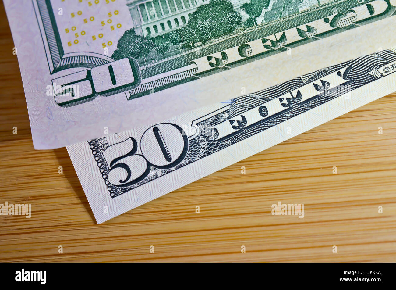 Two Fifty Dollar Bills - 50/50 Chance Concept Stock Photo